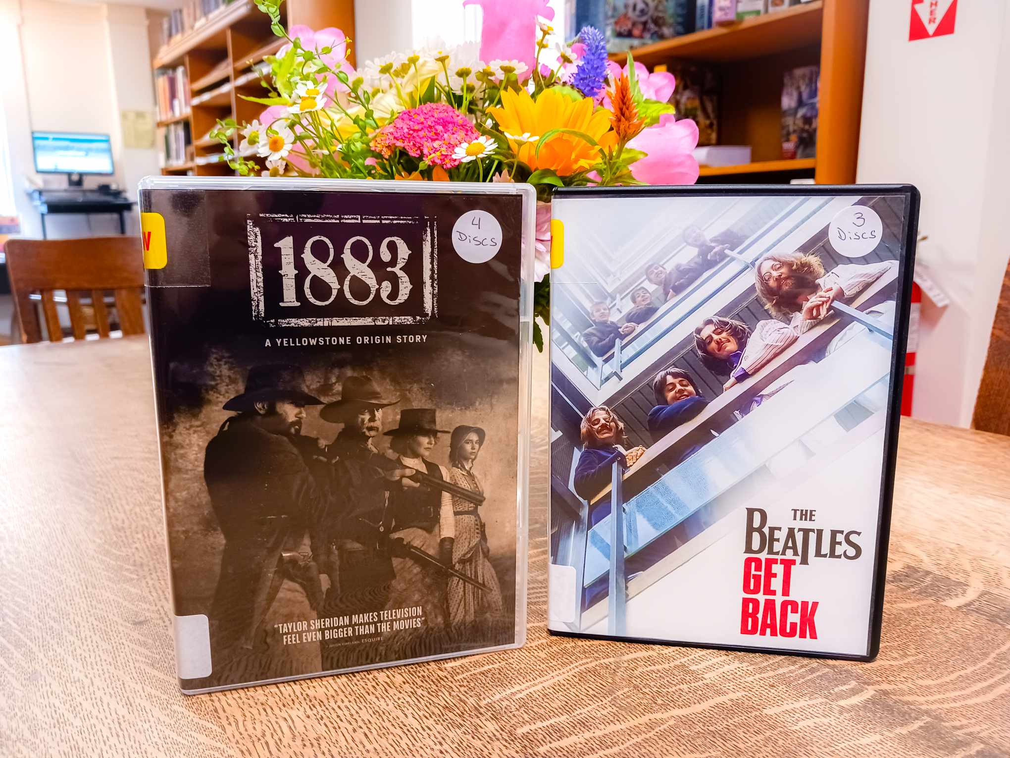 photograph of DVDs - "1883 A Yellowstone Origin Story" and "The Beatles Get Back"