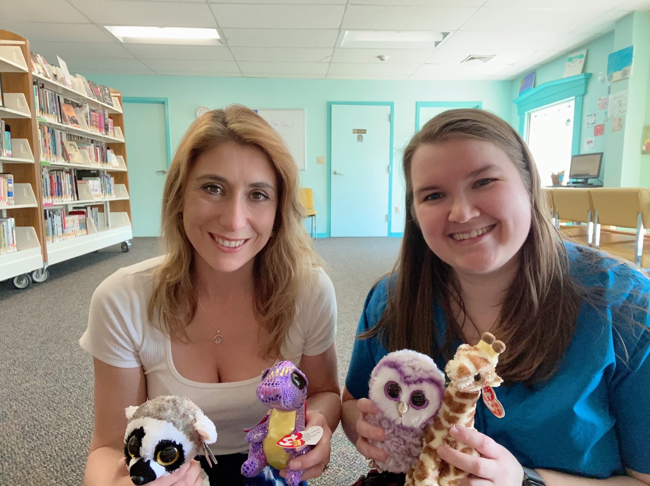 Michelle and Joella holding stuffies