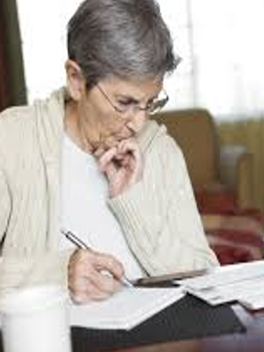 photo of elderly woman writing